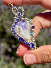 Load image into Gallery viewer, Artisan cab (positive rock) purple aurora opal plume agate doublet with amethyst, blue topaz gem accents wire wrapped pendant necklace