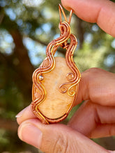 Load image into Gallery viewer, Orange calcite with sunstone + hematite gem accents wire wrapped pendant necklace