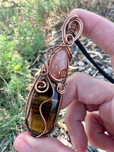 Load image into Gallery viewer, Reserved for Alina p Peach Moonstone + Tiger’s Eye wire wrapped pendent