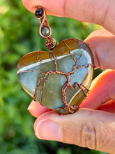 Load image into Gallery viewer, Artisan cab (positive rock) polychrome desert jasper with green tourmaline + blue tiger eye gem accents tree of life wrap wire wrapped pendant necklace