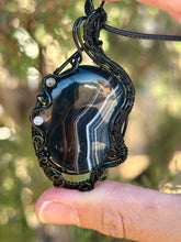 Load image into Gallery viewer, Black banded agate with labradorite + onyx gem accents wire wrapped pendant necklace