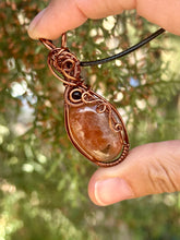 Load image into Gallery viewer, Sunstone with obsidian gem accents wire wrapped pendant necklace