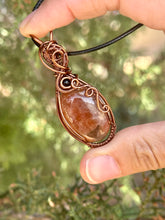 Load image into Gallery viewer, Sunstone with obsidian gem accents wire wrapped pendant necklace