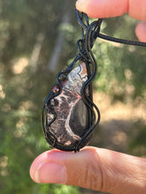 Load image into Gallery viewer, Artisan cab (johari gems) Lava vein Crazy lace agate with obsidian and garnet gem accents wire wrapped pendant necklace