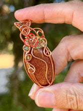 Load image into Gallery viewer, Goldstone “pumpkin” with green aventurine + peridot gem accents wire wrapped pendant necklace