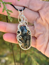 Load image into Gallery viewer, Crinoid fossil with black tourmaline gem accent wire wrapped pendant necklace