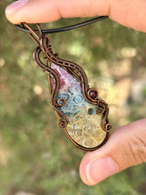 Load image into Gallery viewer, Rainbow Fossilized Palm Root with garnet gem accent wire wrapped pendant necklace