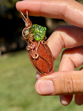 Load image into Gallery viewer, Goldstone “pumpkin” with green aventurine + peridot gem accents wire wrapped pendant necklace