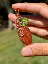 Load image into Gallery viewer, Goldstone “pumpkin” with green aventurine + peridot gem accents wire wrapped pendant necklace