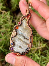 Load image into Gallery viewer, Artisan cab (positive rock) white crazy lace agate with chakra gem accents wire wrapped pendant necklace