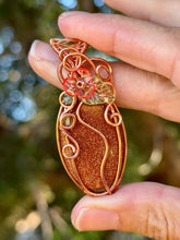 Load image into Gallery viewer, Goldstone “pumpkin” with green aventurine + peridot gem accents wire wrapped pendant necklace