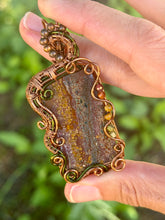 Load image into Gallery viewer, Artisan cab (positive rock) Scenic Plume Jasper with Garnet, Orange Garnet, Yellow Mookaite, Tiger Eye, Serpentine + Peridot Gem Accents wire wrapped pendant necklace