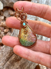 Load image into Gallery viewer, Artisan cab (positive rocks) rainbow fossilized palm root with turquoise gem accent wire wrapped pendant necklace