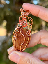 Load image into Gallery viewer, Goldstone “pumpkin” with green aventurine + peridot gem accents wire wrapped pendant necklace