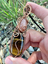 Load image into Gallery viewer, Reserved for Alina p Peach Moonstone + Tiger’s Eye wire wrapped pendent
