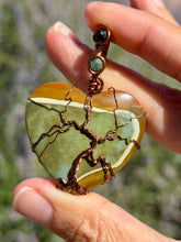 Load image into Gallery viewer, Artisan cab (positive rock) polychrome desert jasper with green tourmaline + blue tiger eye gem accents tree of life wrap wire wrapped pendant necklace