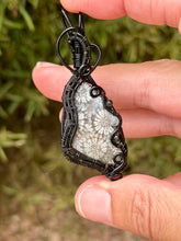 Load image into Gallery viewer, Artisan cab (positive rocks) black fossilized coral with obsidian + rutile quartz gem accents wire wrapped pendant necklace