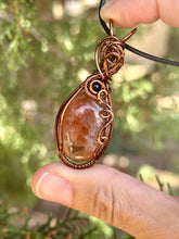 Load image into Gallery viewer, Sunstone with obsidian gem accents wire wrapped pendant necklace
