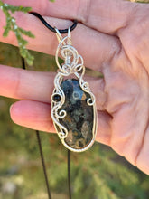 Load image into Gallery viewer, Crinoid fossil with black tourmaline gem accent wire wrapped pendant necklace