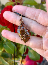 Load image into Gallery viewer, Morrocan seam agate with garnet gem accents wire wrapped pendant necklace