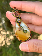 Load image into Gallery viewer, Artisan cab (positive rock) polychrome desert jasper with green fluorite gem accents wire wrapped pendant necklace