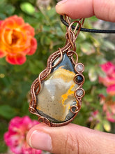 Load image into Gallery viewer, Artisan cab (johari gems) bumblebee jasper with rutile quartz + onyx gem accents wire wrapped pendant necklace