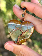 Load image into Gallery viewer, Artisan cab (positive rock) polychrome desert jasper with green tourmaline + blue tiger eye gem accents tree of life wrap wire wrapped pendant necklace