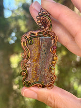 Load image into Gallery viewer, Artisan cab (positive rock) Scenic Plume Jasper with Garnet, Orange Garnet, Yellow Mookaite, Tiger Eye, Serpentine + Peridot Gem Accents wire wrapped pendant necklace