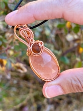 Load image into Gallery viewer, Faceted peach moonstone with amber gem inclusions wire wrapped pendant necklace
