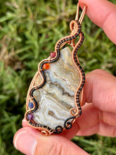 Load image into Gallery viewer, Artisan cab (positive rock) white crazy lace agate with chakra gem accents wire wrapped pendant necklace