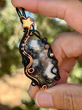 Load image into Gallery viewer, Artisan cab (positive rocks) scenic black maligano with sunstone, hematite, rutile quartz, opalite gem accents wire wrapped pendant necklace