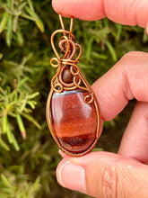 Load image into Gallery viewer, Red tiger eye with Baltic amber gem accent wire wrapped pendant necklace