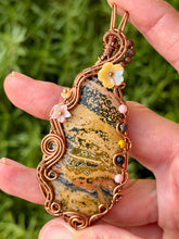 Load image into Gallery viewer, Artisan cab (positive rock) yellow ocean jasper with pink opal, zoisite, yellow mookaite gem accents wire wrapped pendant necklace