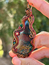 Load image into Gallery viewer, Artisan cab (positive rock) Indian bloodstone with malachite, garnet, mookaite gem accents wire wrapped pendant necklace