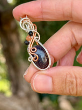 Load image into Gallery viewer, Artisan cab Bloodshot Iolite (sunstone/iolite) with rutile quartz + sunstone gem accents wire wrapped pendant necklace