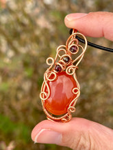 Load image into Gallery viewer, Carnelian with tigers eye + garnet inclusions Wire wrapped pendant
