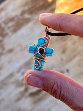 Load image into Gallery viewer, Blue (dyed) magnesite cross with black spinel  Wire wrapped pendant
