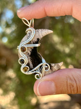 Load image into Gallery viewer, Artisan cab (positive rocks) fossilized palm root crescent moon with tiger eye + tourmaline gem accents wire wrapped pendant necklace
