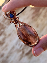 Load image into Gallery viewer, Iolite with sunstone with lapis lazuli inclusion   Wire wrapped pendant
