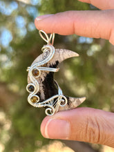 Load image into Gallery viewer, Artisan cab (positive rocks) fossilized palm root crescent moon with tiger eye + tourmaline gem accents wire wrapped pendant necklace
