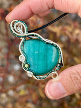 Load image into Gallery viewer, Reserved for Sheena h DUO TONED WIRE Emerald Mona Lisa cat’s eye with quartz + turquoise inclusions Wire wrapped pendant
