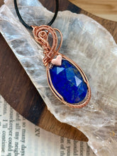 Load image into Gallery viewer, Faceted lapis lazuli with hematite heart Wire wrapped pendant
