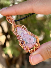 Load image into Gallery viewer, Rhodochrosite with Rhodonite and Ruby inclusions wire wrapped pendant talisman necklace
