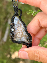 Load image into Gallery viewer, artisan cab (positive rock) black fossilized coral with obsidian + moonstone gem stone accents wire wrapped pendant necklace
