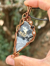 Load image into Gallery viewer, Artisan stone (cab by positive rocks) Black scenic Maligano Jasper with mother of pearl + onyx inclusions Wire wrapped pendant
