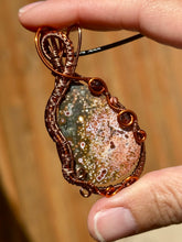 Load image into Gallery viewer, DUO TONED WIRE + DESIGNER CAB ocean jasper with garnet + carnelian inclusions  Wire wrapped pendant
