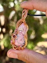 Load image into Gallery viewer, Rhodochrosite with Rhodonite and Ruby inclusions wire wrapped pendant talisman necklace
