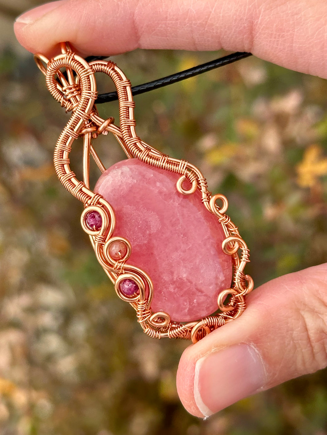 DESIGNER STONE Rhodochrosite with ruby + thulite inclusions Wire wrapped pendant