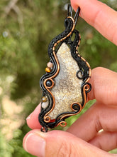 Load image into Gallery viewer, Artisan cab (positive rock) fossilized coral with peach moonstone, tiger eye, black tourmaline gem accents wire wrapped pendant necklace
