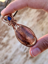 Load image into Gallery viewer, Iolite with sunstone with lapis lazuli inclusion   Wire wrapped pendant
